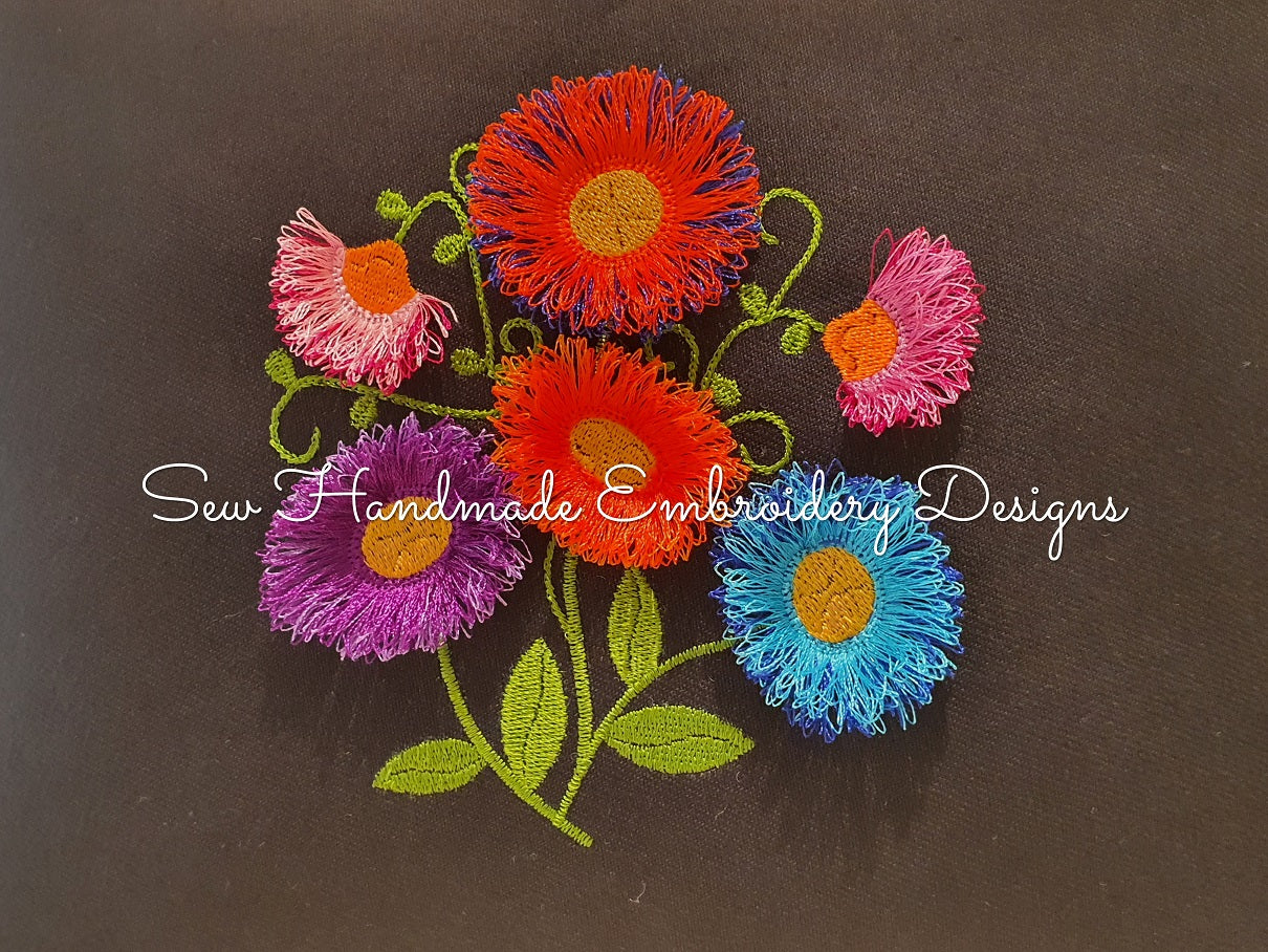 Fringe Flowers machine embroidery design stitched on black canvas