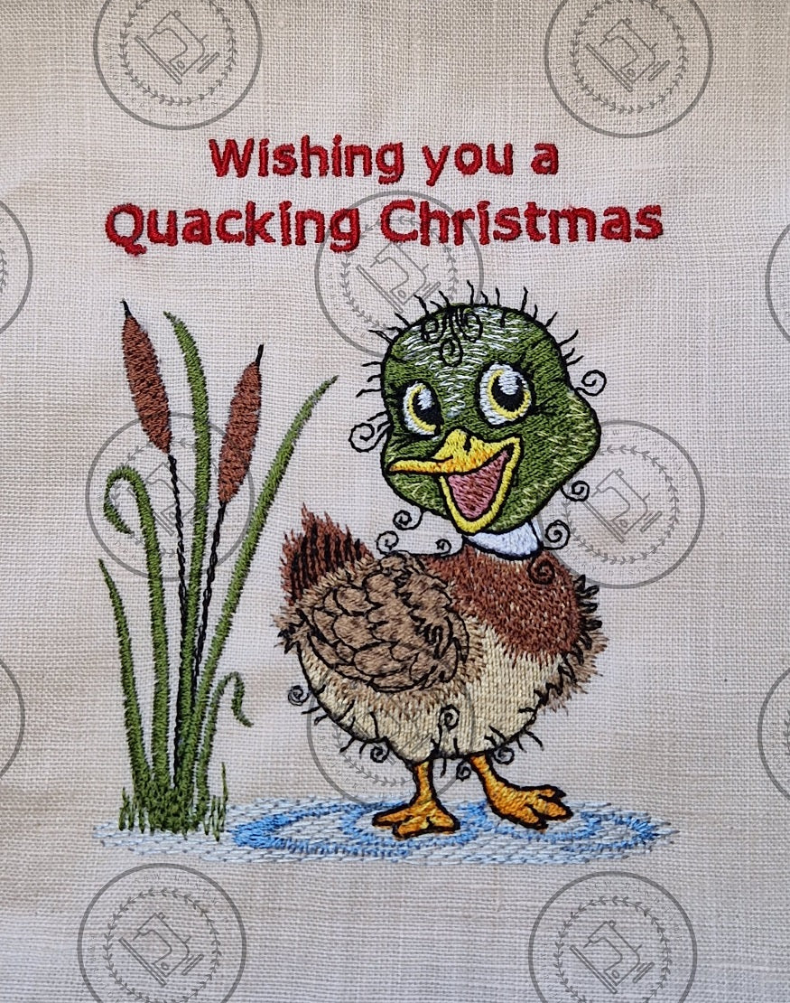 "An embroidered design of a cheerful mallard duck with a vibrant green head, brown and beige body, and yellow beak. The duck is standing in a small blue puddle next to tall cattail reeds, with a whimsical and curly detailing style."