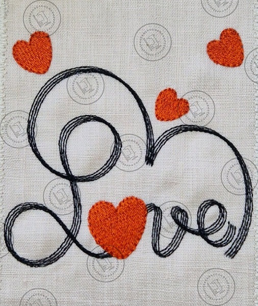 "An embroidered design featuring the word 'Love' in cursive script, stitched with black thread. The letter 'o' is shaped like a red heart, and additional red hearts are scattered decoratively around the design on a light fabric background."